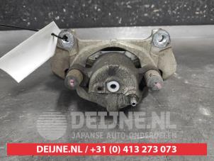 Toyota Yaris Front brake calliper, left O707542 photo 2