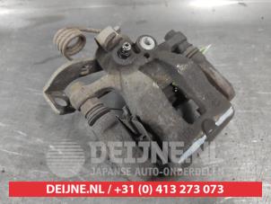 Kia Rio Rear brake calliper, left O720415 photo 2