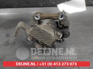 Suzuki Swift Rear brake calliper, left O722262 photo 2