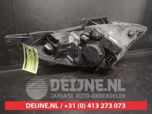Hyundai I20 Koplamp links O723042 foto 3