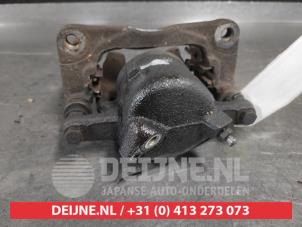 Suzuki Swift Front brake calliper, left O723322 photo 2