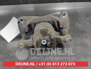 Suzuki Swift Front brake calliper, left O724795 photo 2