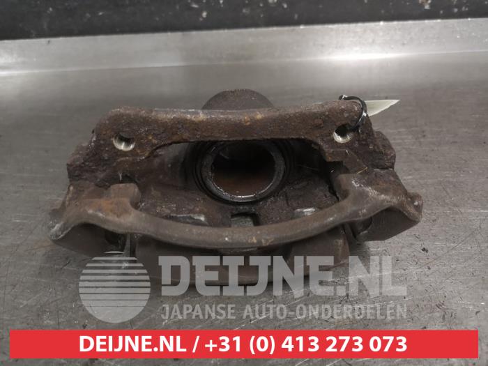 Toyota Yaris Front brake calliper, left O725493