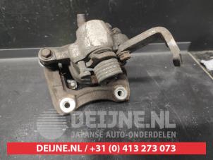 Suzuki Swift Rear brake calliper, left O728621 photo 2