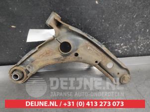 Toyota Yaris Querlenker unten links vorne O731755 foto 2