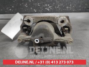 Lexus IS Bremszange links vorne O732370 foto 2