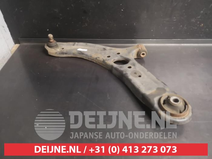 Kia Rio Draagarm onder links-voor O737136