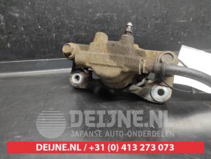 Mitsubishi Lancer Rear brake calliper, left O742692 photo 2