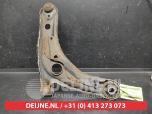 Toyota Yaris Querlenker unten links vorne O743302 foto 2