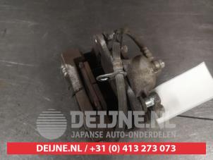 Suzuki Ignis Front brake calliper, left O743947 photo 2