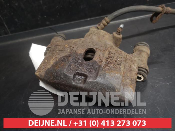Toyota Starlet Front brake calliper, left O746671