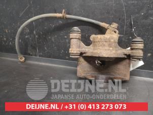 Toyota Starlet Bremszange links vorne O746671 foto 2