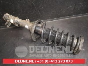 Hyundai Matrix Schokdemperpoot links-achter O747010 foto 2