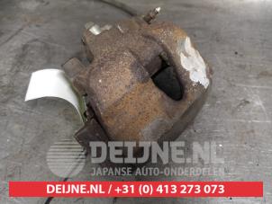 Nissan Primera Bremszange links vorne O216024 foto 2