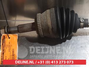 Nissan Almera Aandrijfas rechts-voor O319233 foto 2