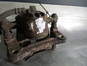 Mitsubishi Carisma Bremszange links vorne O325193 foto 2