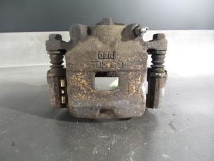 Daihatsu Cuore Bremszange links vorne O325395 foto 2