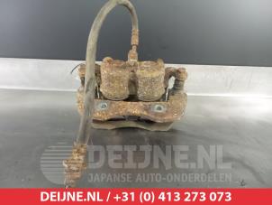 Nissan King Cab Bremszange links vorne O324930 foto 2