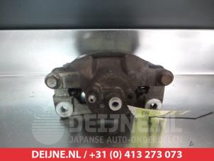 Toyota IQ Bremszange links vorne O325683 foto 2