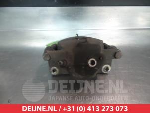 Suzuki Swift Front brake calliper, left O325515 photo 2