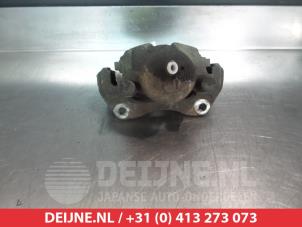 Toyota Avensis Bremszange links vorne O325644 foto 2