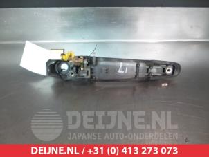 Toyota Previa Door handle 4-door, front left O277384 photo 2
