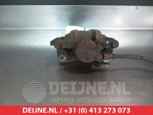 Toyota Previa Bremszange links hinten O376561 foto 2