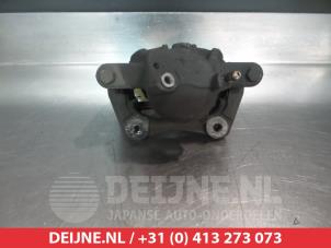 Nissan Micra CC Front brake calliper, right O326200 photo 2