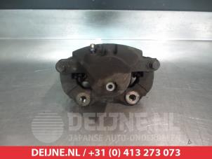 Nissan Almera Tino Front brake calliper, left O324875 photo 2