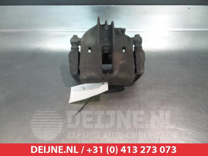Mitsubishi Carisma Bremszange links vorne O325199