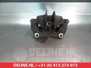Mitsubishi Carisma Bremszange links vorne O325199 foto 2