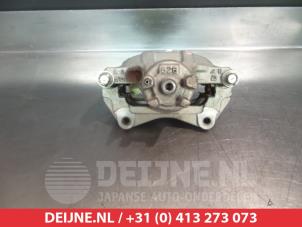 Mitsubishi Lancer Front brake calliper, left O325183 photo 2