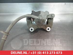 Subaru Justy Bremszange links vorne O324955 foto 2
