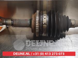 Toyota Yaris Aandrijfas links-voor O318571 foto 2