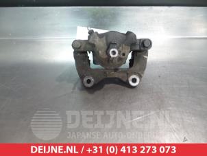 Subaru Justy Bremszange links vorne O324959 foto 2