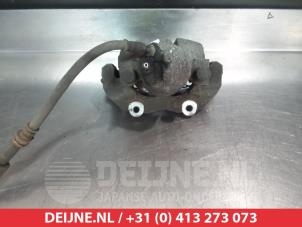 Mazda 3 Bremszange links vorne O324542 foto 2