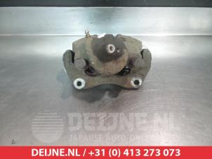 Toyota Avensis Bremszange links vorne O325648 foto 2