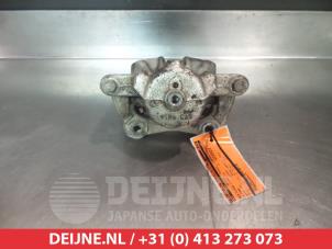 Nissan Note Front brake calliper, left O324813 photo 2