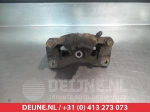 Subaru Legacy Bremszange links hinten O376235 foto 2