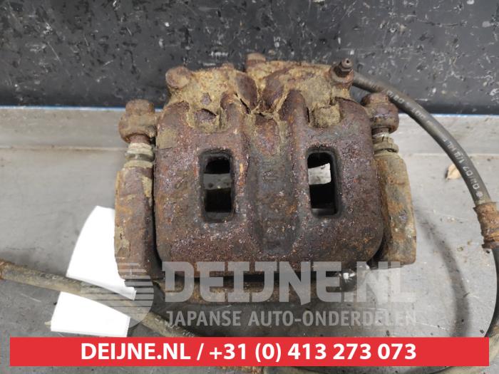 Mitsubishi Pajero Bremszange rechts vorne O326497