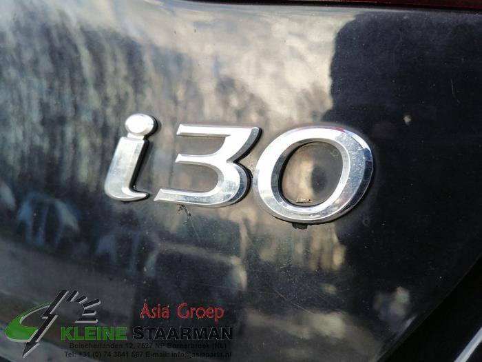 Schokdemper links-achter van een Hyundai i30 (GDHB5) 1.4 16V 2015