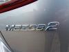 Gasdemperset Achterklep van een Mazda 2 (DJ/DL), 2014 1.5 SkyActiv-G 90, Hatchback, Benzine, 1.496cc, 66kW, P5Y5; P5Y7; P5Y8, 2014-11 2016