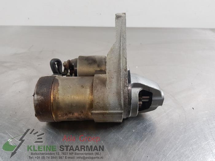 Startmotor van een Nissan Primera Wagon (W12) 2.0 16V 2005