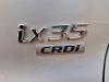Schokbreker links-achter van een Hyundai iX35 (LM), 2010 / 2015 1.7 CRDi 16V, SUV, Diesel, 1.685cc, 85kW (116pk), FWD, D4FD, 2010-11 / 2015-09, F5D31; F5D41 2013