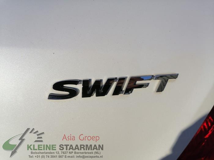 Schokdemper links-achter van een Suzuki Swift (ZA/ZC/ZD) 1.2 16V 2010