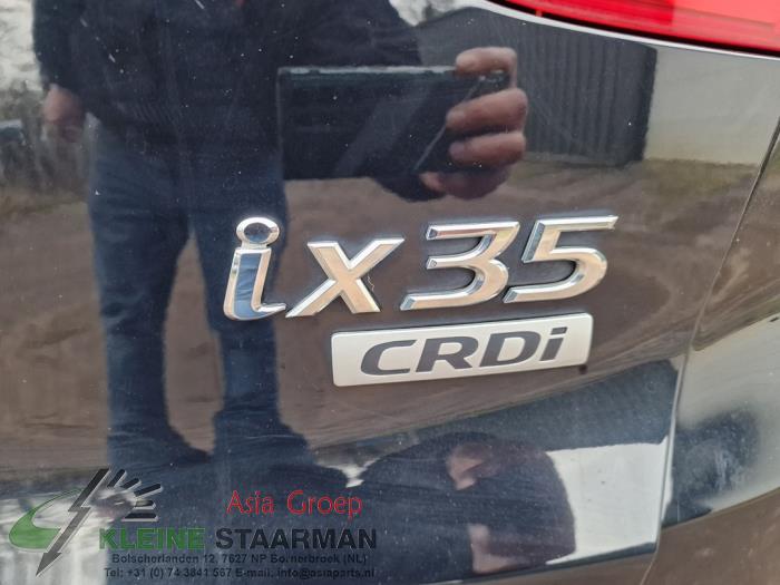 Schokdemper links-achter van een Hyundai iX35 (LM) 1.7 CRDi 16V 2015