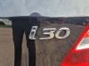 Fusee links-achter van een Hyundai i30 (FD), 2007 / 2011 1.4 CVVT 16V, Hatchback, Benzine, 1.396cc, 80kW (109pk), FWD, G4FA, 2007-10 / 2011-11, B5P2; B5P8; B5PC; B5PG 2011