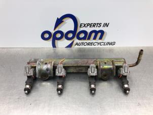 Gebruikte Injector brug Nissan Micra (K12) 1.2 16V Prijs € 72,00 Margeregeling aangeboden door Gebr Opdam B.V.