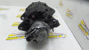 Dynamo van een Nissan Vanette (C22) 2.0 D 1993