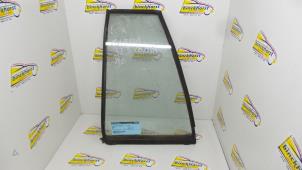 Gebruikte Driehoeks Ruit links-achter Mazda 323 Prijs € 26,25 Margeregeling aangeboden door Binckhorst BV